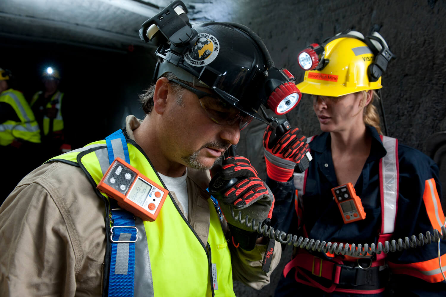 man woman talking gas detector man woman talking gas detector